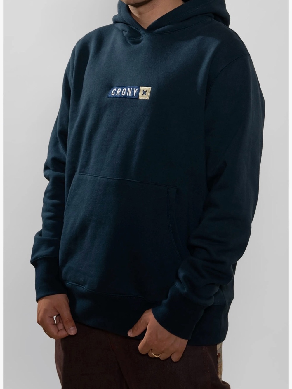 CRONY X black hoodie with teal Green Accent Logo